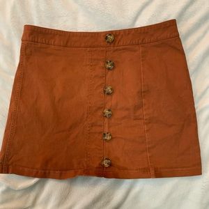 A cute rusty orange mini skirt!